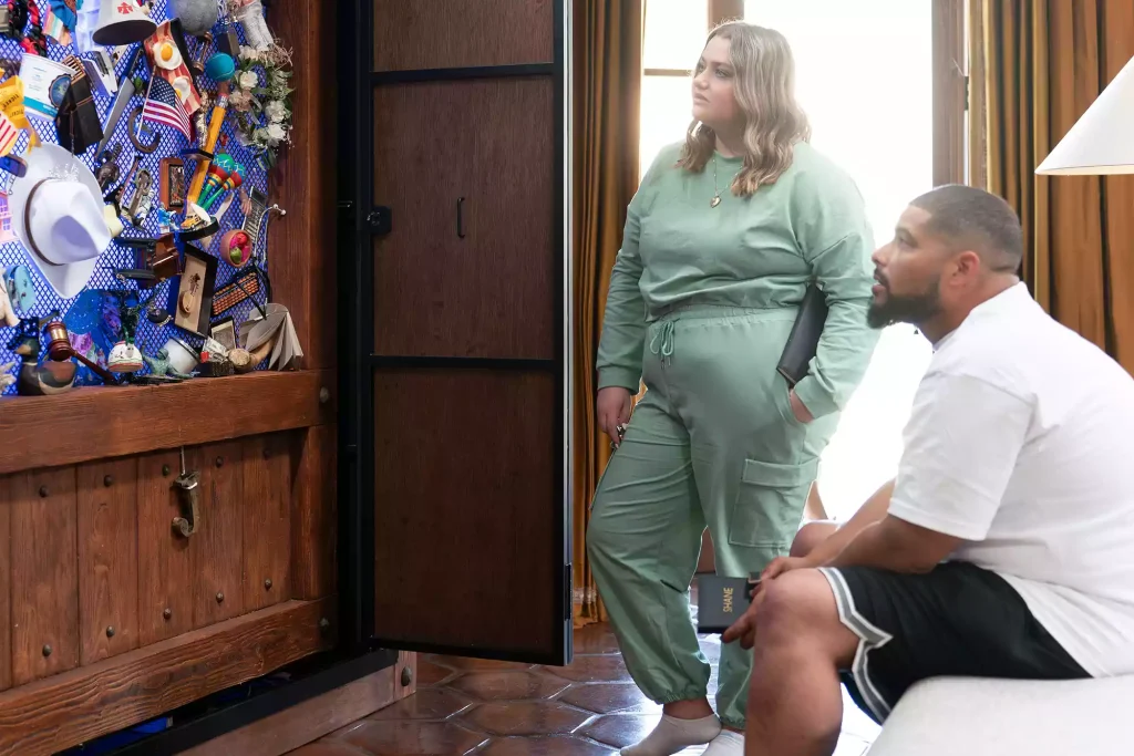 Jill and Shane looking at Claim to Fame clue wall. (PHOTO: VIA PEOPLE, DISNEY/CHRIS WILLARD)