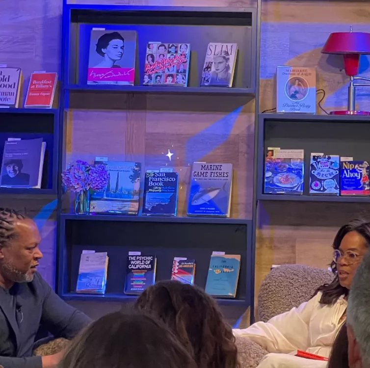 Author Shaka Senghor speaks with Oprah Winfrey at Godmothers bookstore in California. (PHOTO: Laura Lynne Jackson/Instagram)